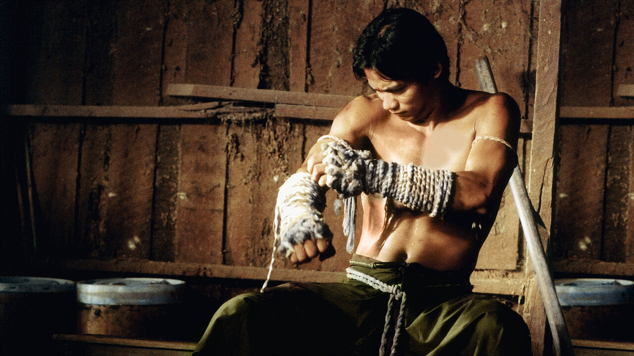 Tony Jaa Ong Bak Muay Thai Warrior 2003 trousers on fire